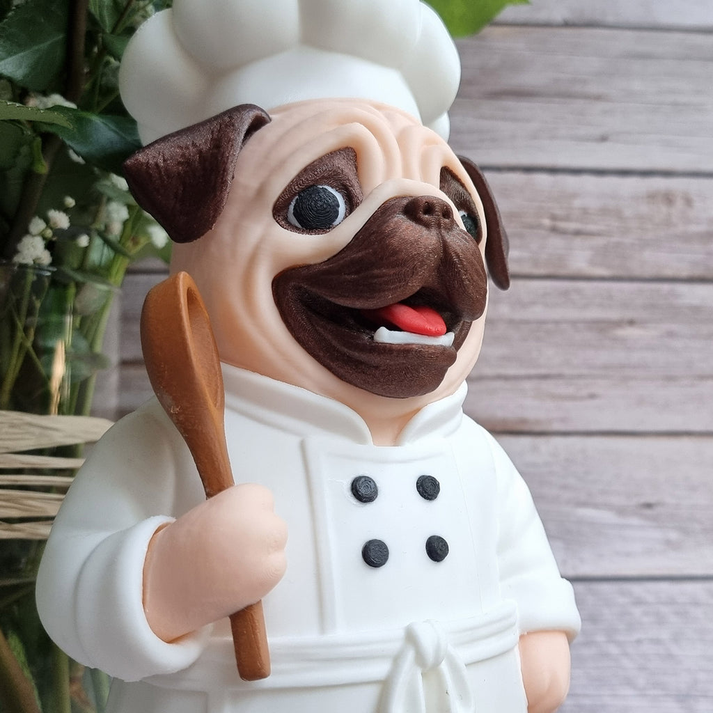 Close-up of the chef's hat, muzzle wrinkles and the wooden spoon