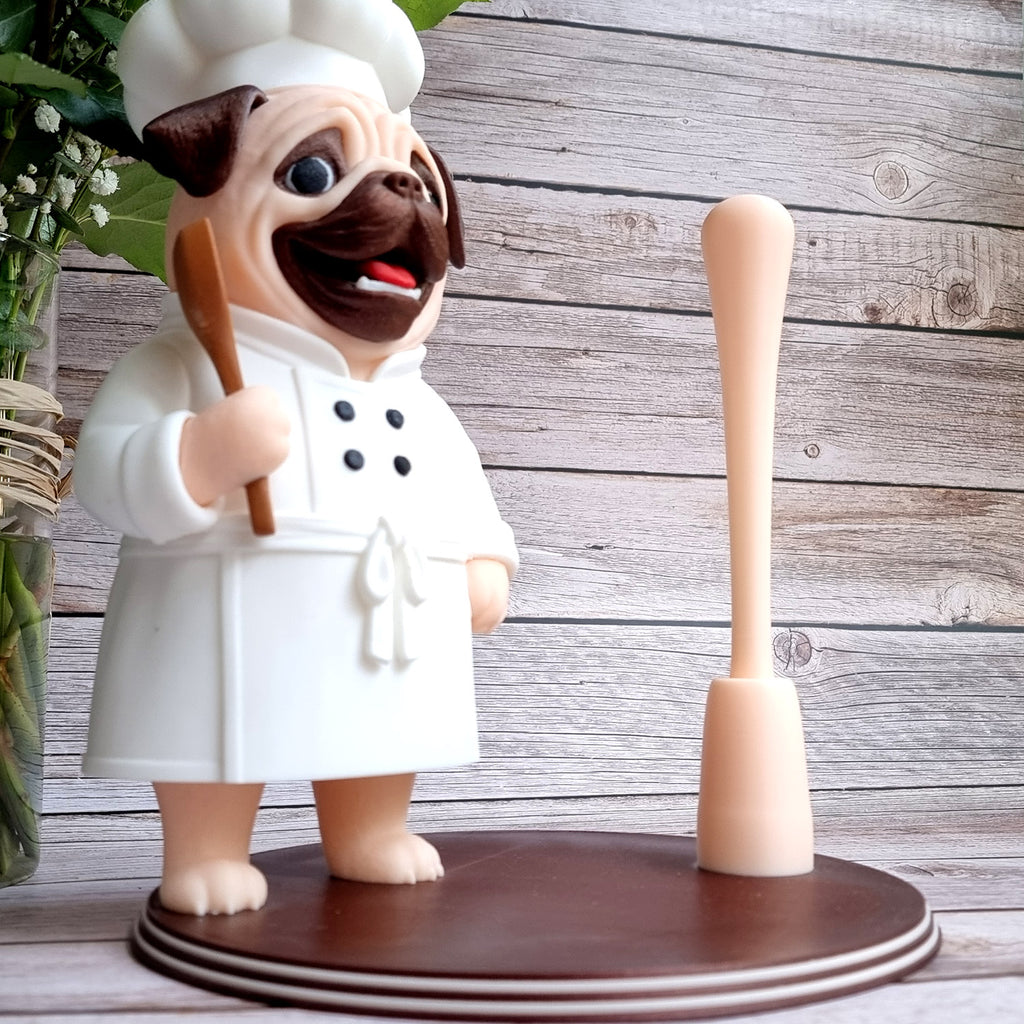 The holder with the rod empty, showing how tall a roll it takes, wooden spoon in the pug's paw