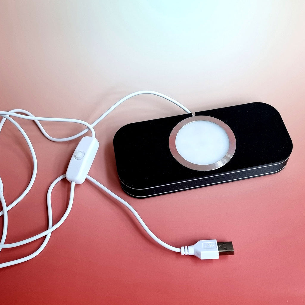 The illuminated magnetic display base lit, with its USB-A cable and in-line on-off switch