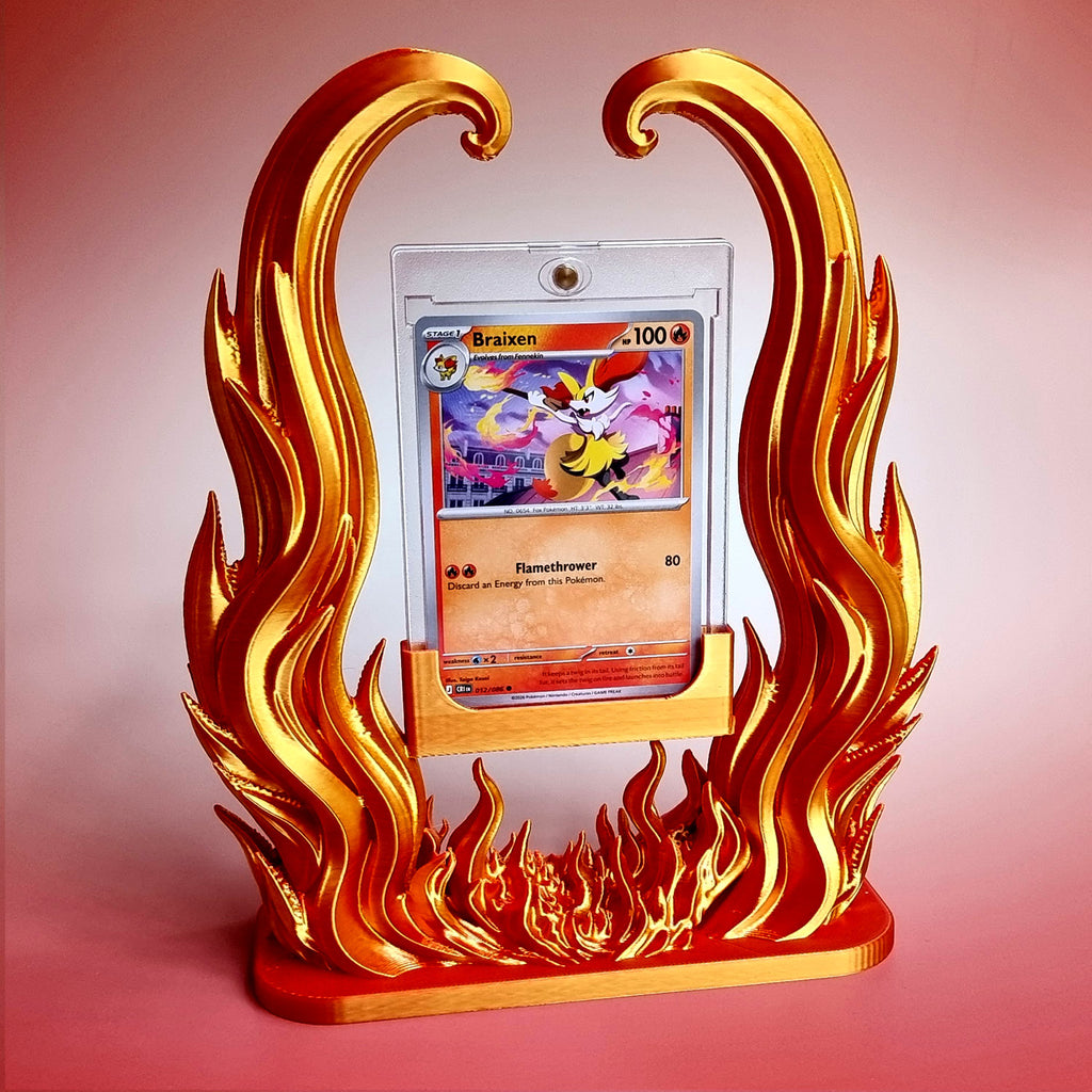 Blazing Arc card holder in gold and red, a trading card in its clear one-touch case framed by sculpted flames